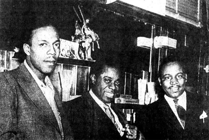 Jazz musician, Louis Armstrong, with the owners of the Dude Ranch